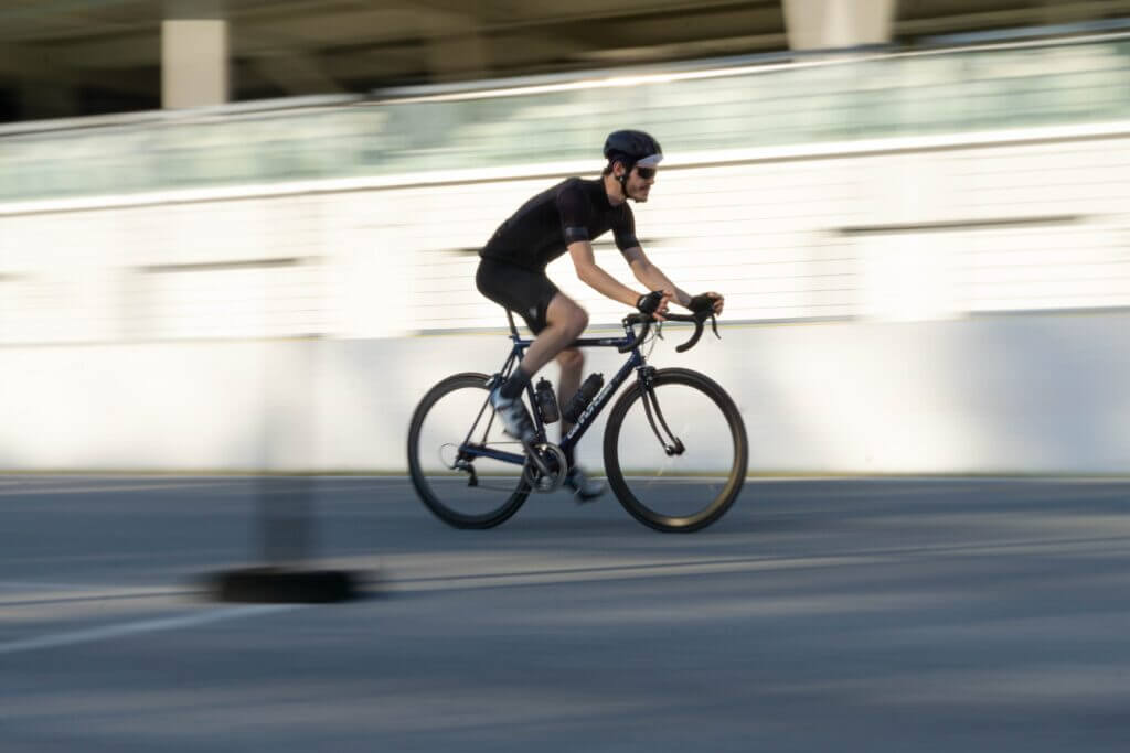 a man cyclist a road bike fast