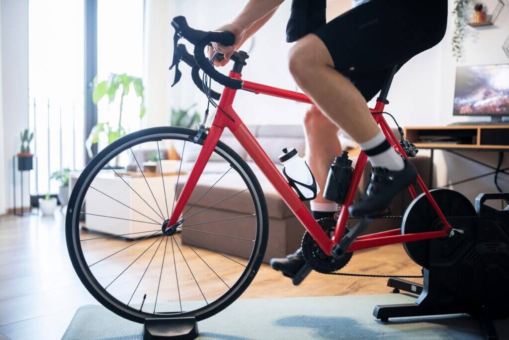 a cyclist using an indoor bike trainer