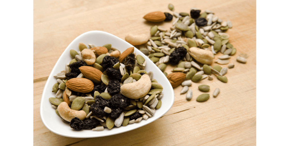 a bowl with a mixture of nuts and seeds