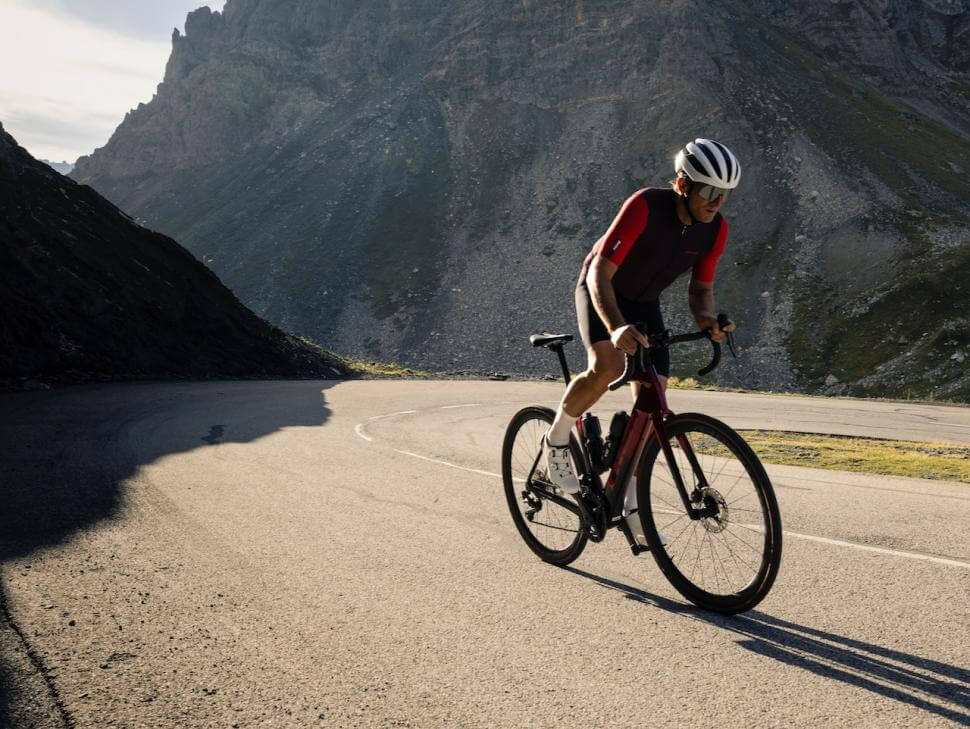 a cyclist on an electric road bike going up a hill