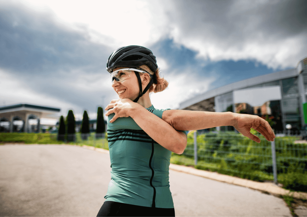 a female cyclist stretching her arms