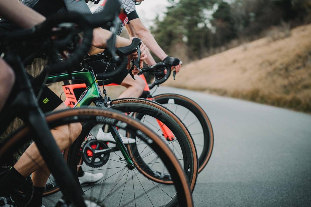 3 road bikes side by side showing the front wheels with tubeless tires