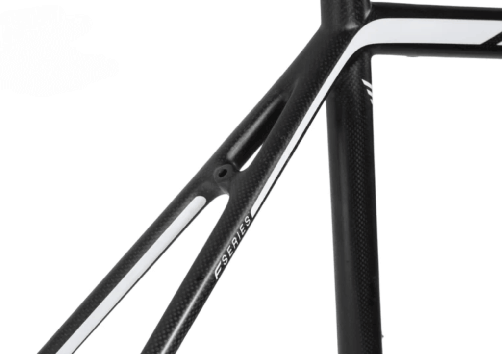 a close up of carbon fibre on a road bicycle frame