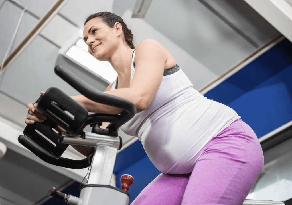 pregnant woman on stationary bike